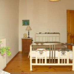 Third bedroom of Sior Nikoletos with a comfortable double bed and traditional Cretan accents